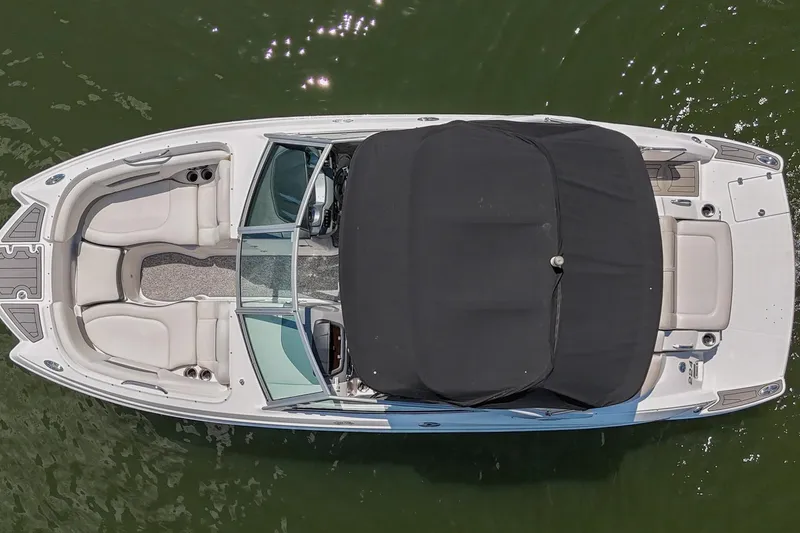Slide: The Image of Overhead view of 2014 Chaparral 224 Sunesta boat on water, featuring sleek design and spacious seating. - 8