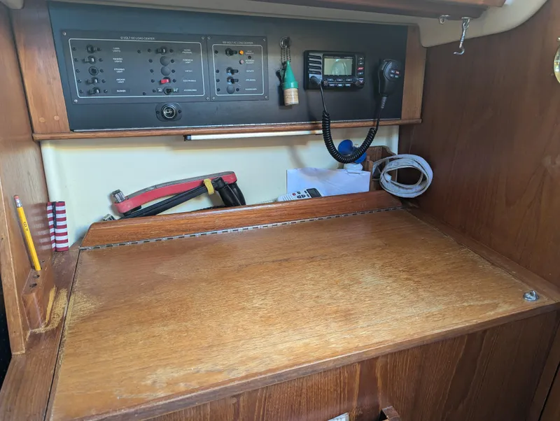 Slide: The Image of Navigation station on 1985 Pearson P-28 sailboat with control panel and radio equipment. - 18
