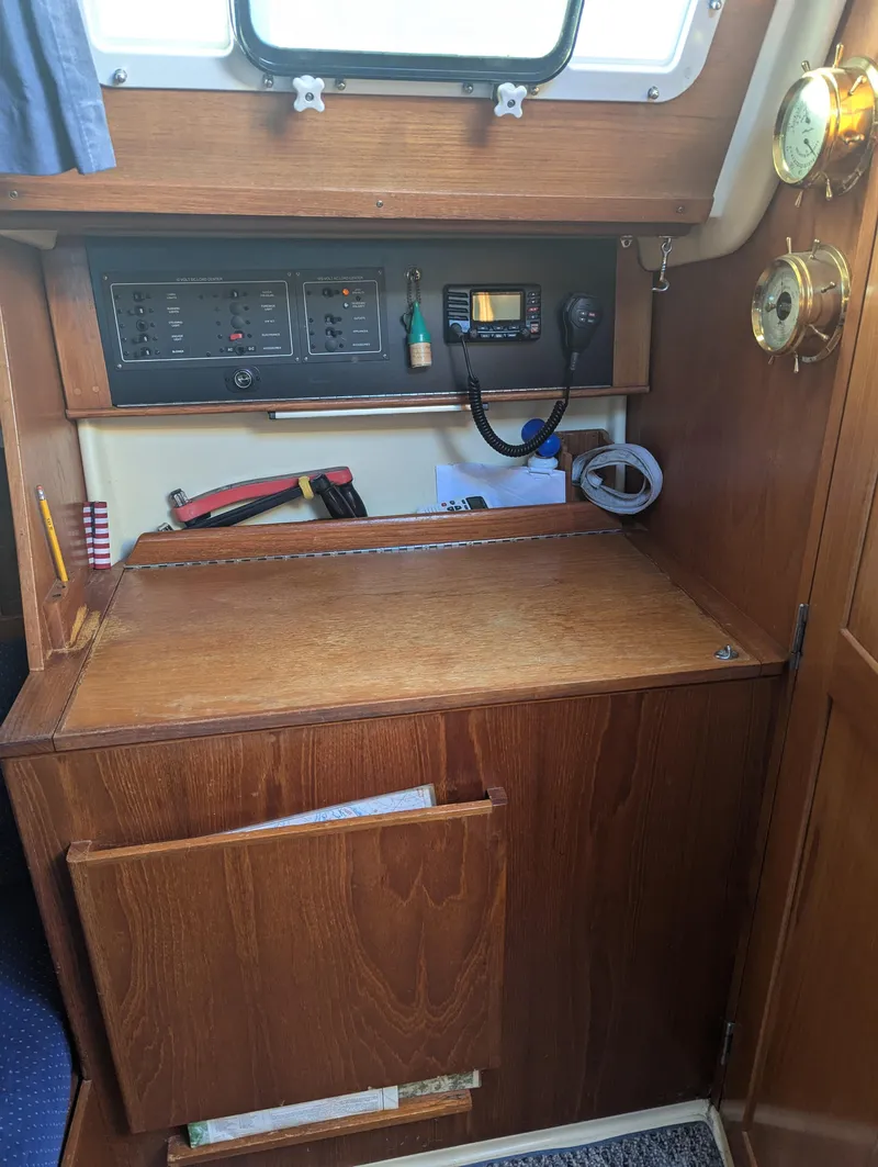 Slide: The Image of Navigation station on 1985 Pearson P-28 sailboat with control panel and equipment. - 19