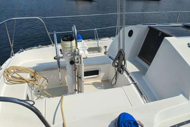 Slide: The Image of Cockpit of a 1985 Pearson P-28 sailboat with steering wheel and ropes. - 30