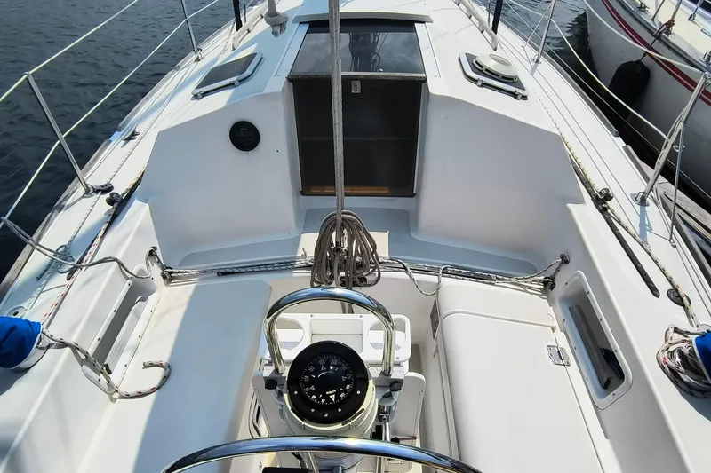 Slide: The Image of Cockpit of 1985 Pearson P-28 sailboat with steering wheel and navigation instruments. - 33