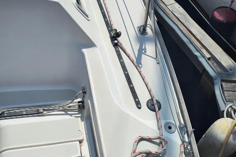 Slide: The Image of Cockpit view of a 1985 Pearson P-28 sailboat with ropes and dock. - 37