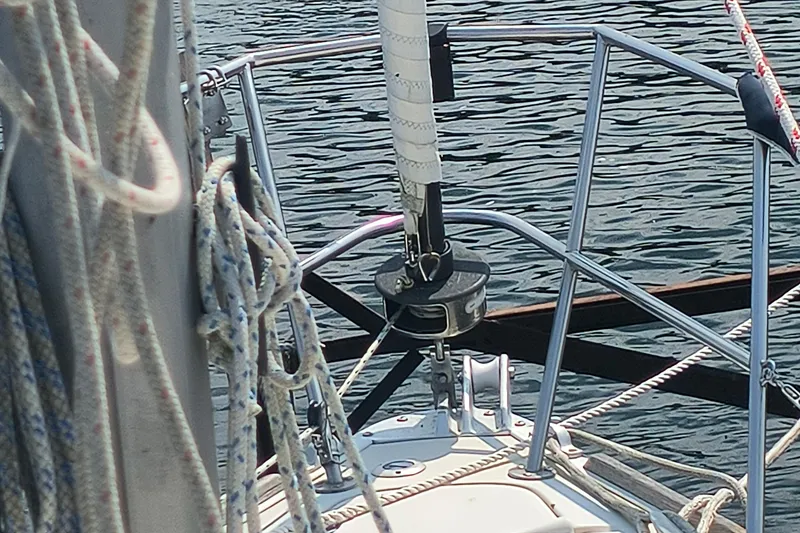 Slide: The Image of Bow of 1985 Pearson P-28 sailboat with ropes and water background. - 38