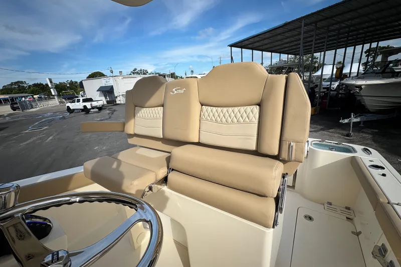 Slide: The Image of Luxurious seating on 2026 Scout 260 LXF boat, featuring beige upholstery and elegant design. - 16
