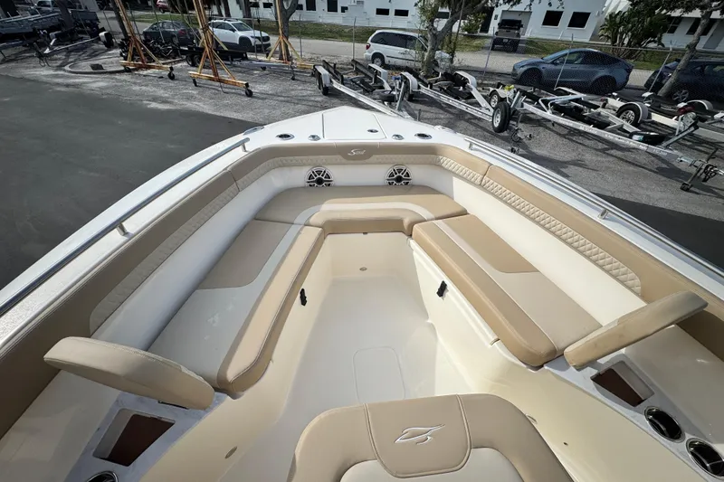 Slide: The Image of 2026 Scout 260 LXF boat interior with beige seating and modern design. - 19