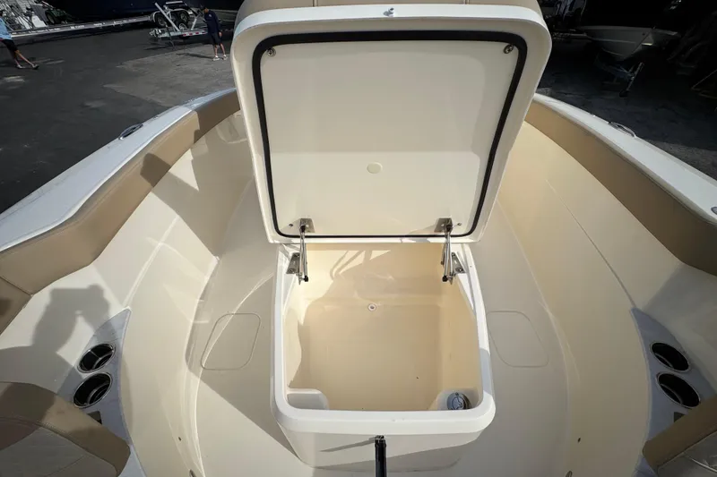 Slide: The Image of Open storage compartment on 2026 Scout 260 LXF boat, showcasing spacious interior design. - 23