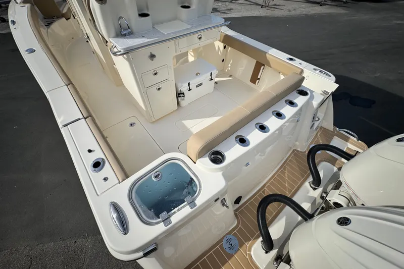 Slide: The Image of 2026 Scout 260 LXF boat interior with seating and storage compartments. - 7