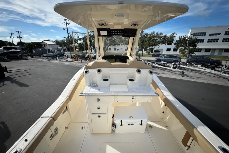 Slide: The Image of 2026 Scout 260 LXF boat interior with fishing station and storage compartments. - 8