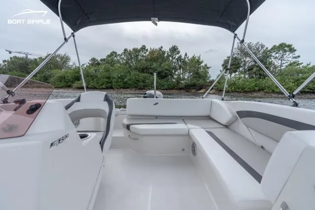 Slide: The Image of 2023 Starcraft SVX 171 OB boat interior with seating and canopy. - 6