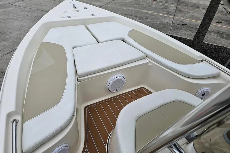 Slide: The Image of 2022 Bulls Bay 2000 boat interior with cushioned seating and speakers. - 15