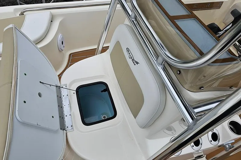 Slide: The Image of 2022 Bulls Bay 2000 boat interior with open storage compartment and seating. - 17