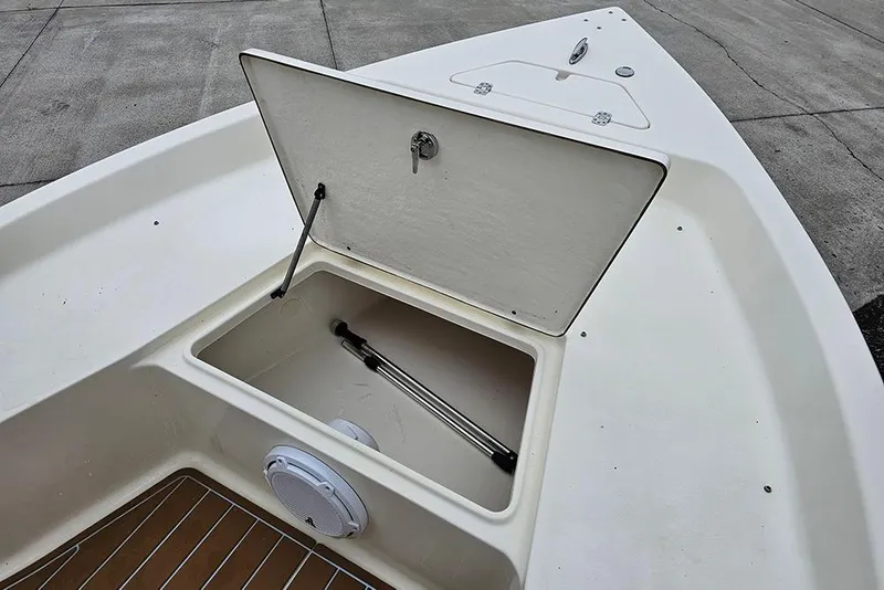 Slide: The Image of Open storage compartment on a 2022 Bulls Bay 2000 boat, showcasing interior details. - 19