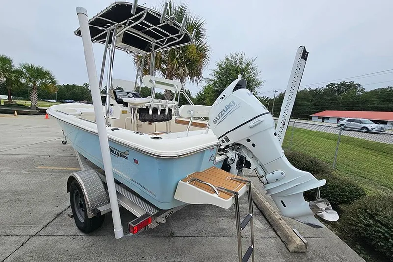 Slide: The Image of 2022 Bulls Bay 2000 boat with Suzuki outboard motor on trailer, parked outdoors. - 3