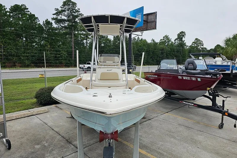 Slide: The Image of 2022 Bulls Bay 2000 boat displayed outdoors, surrounded by other boats and greenery. - 4