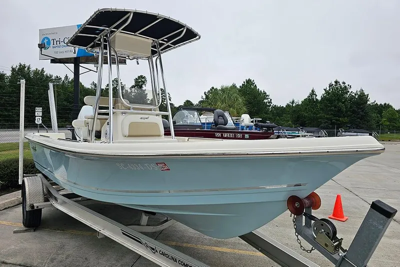 Slide: The Image of 2022 Bulls Bay 2000 boat on trailer in parking lot, overcast sky. - 5