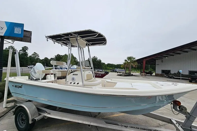 Slide: The Image of 2022 Bulls Bay 2000 boat on trailer, parked outdoors near a building. - 6
