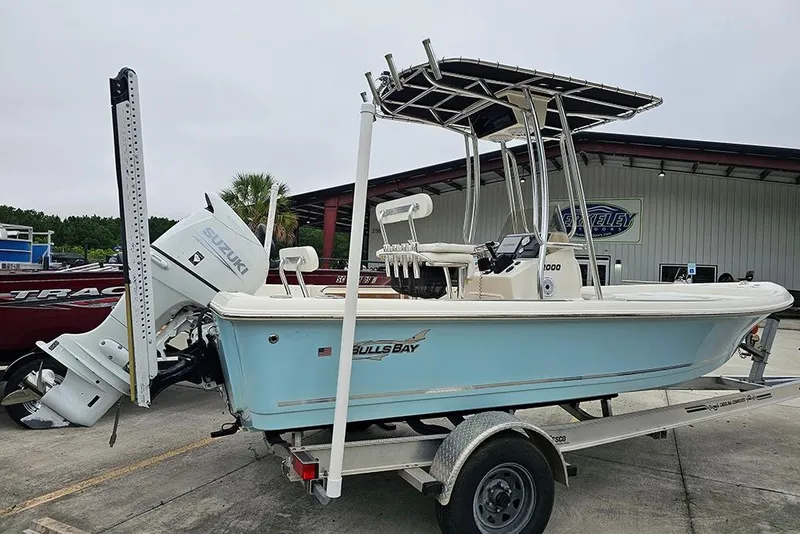 Slide: The Image of 2022 Bulls Bay 2000 boat with Suzuki engine on trailer, parked outdoors. - 7