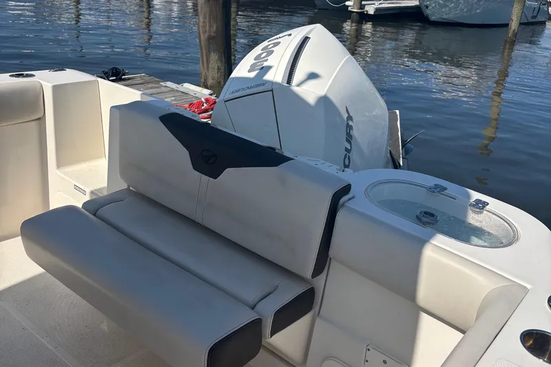 Slide: The Image of 2024 Sailfish 241 CC boat with Mercury engine, featuring comfortable seating and a livewell. - 9
