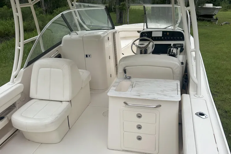 Slide: The Image of 2015 Grady-White Freedom 285 boat interior with seating and helm station. - 6