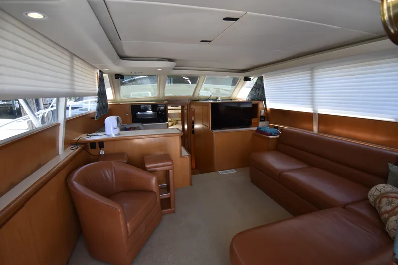 Slide: The Image of Luxurious interior of a 1997 Tiara 4300 yacht with leather seating and modern amenities. - 11