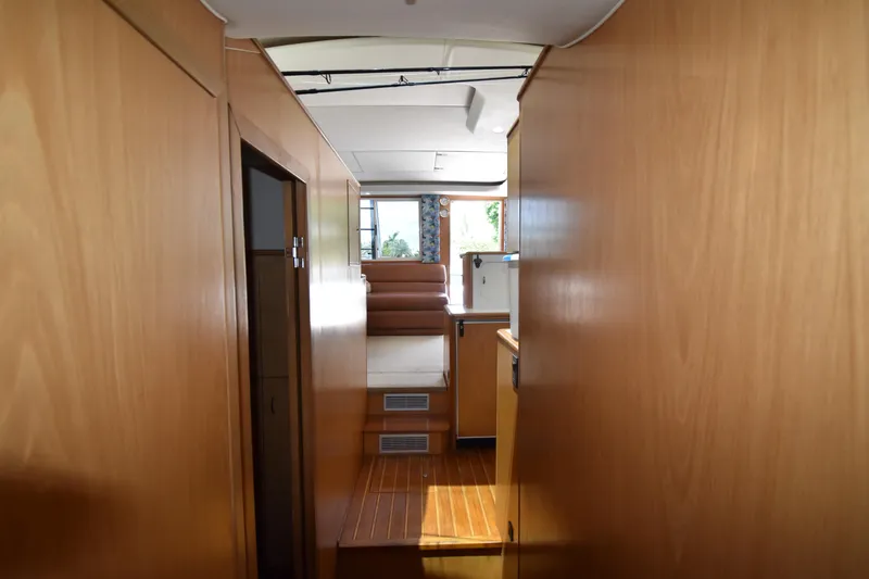 Slide: The Image of Interior view of 1997 Tiara 4300 yacht with wooden paneling and seating area. - 20