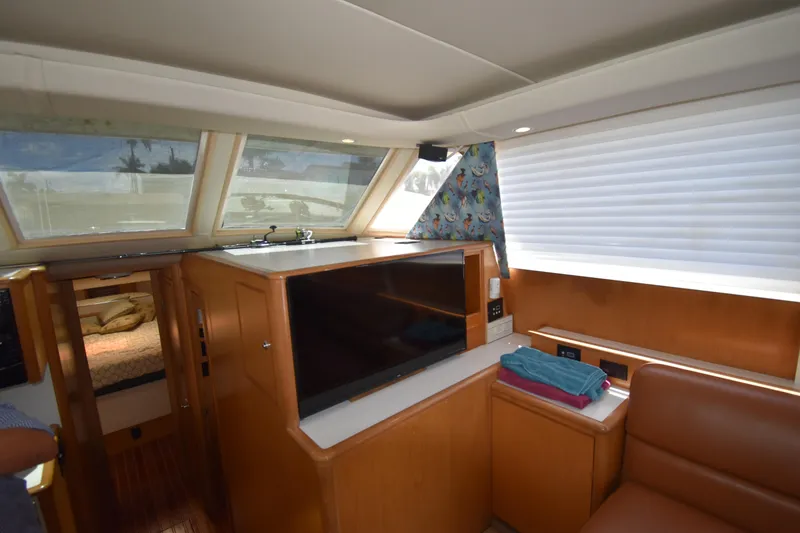 Slide: The Image of Interior of 1997 Tiara 4300 yacht with modern amenities and cozy seating area. - 21