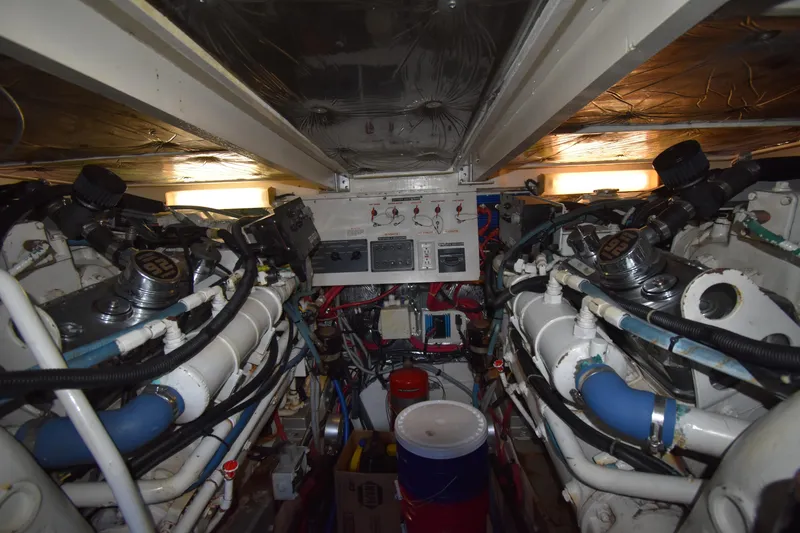 Slide: The Image of Engine room of a 1997 Tiara 4300 boat, showcasing dual engines and control panel. - 30