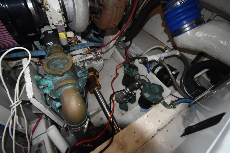 Slide: The Image of Engine compartment of a 1997 Tiara 4300, showcasing mechanical components and wiring. - 34