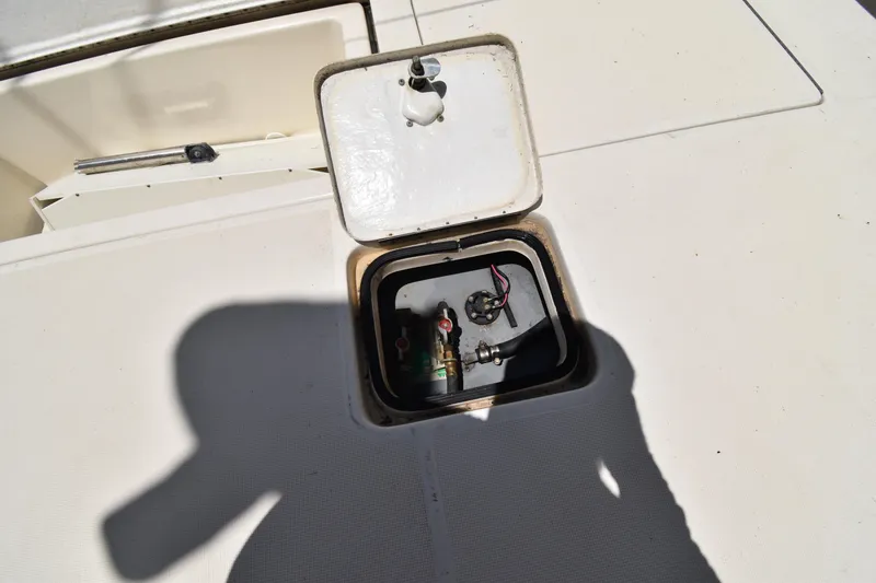 Slide: The Image of Open hatch on 1997 Tiara 4300 boat deck, revealing internal components. - 37