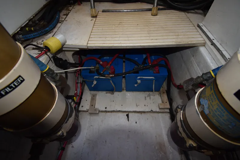 Slide: The Image of Engine compartment of 1997 Tiara 4300 with batteries and filters visible. - 40