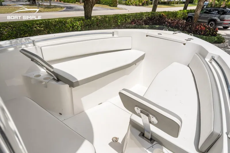 Slide: The Image of 2020 Release 210 RX boat interior with white seating and sleek design. - 13