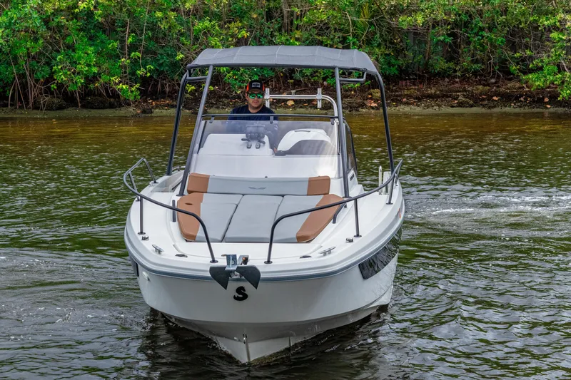 Slide: The Image of 2022 Beneteau America Flyer 8 Sundeck boat cruising on a calm river. - 1