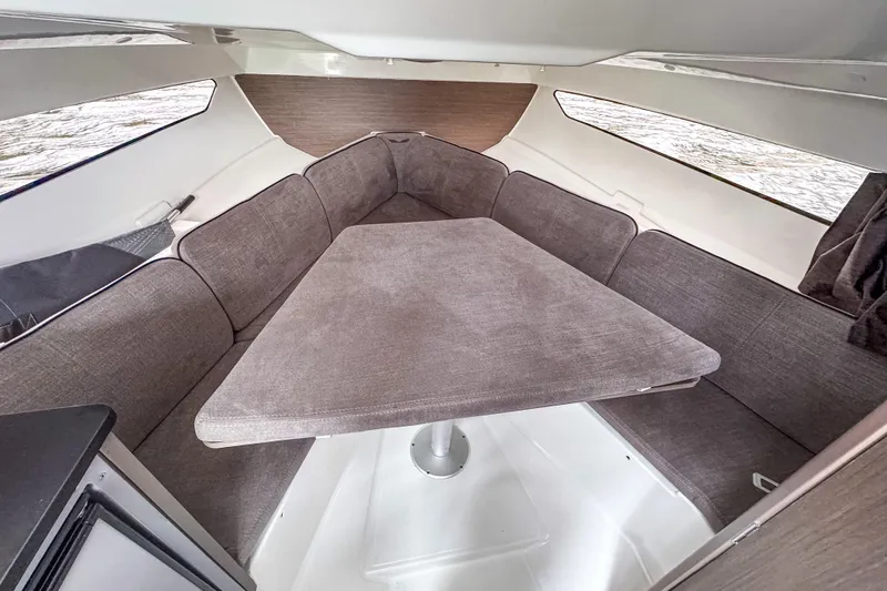 Slide: The Image of Interior of 2022 Beneteau America Flyer 8 Sundeck with cozy seating and table. - 10