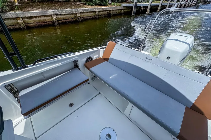 Slide: The Image of 2022 Beneteau America Flyer 8 Sundeck boat interior with seating and outboard motor. - 15