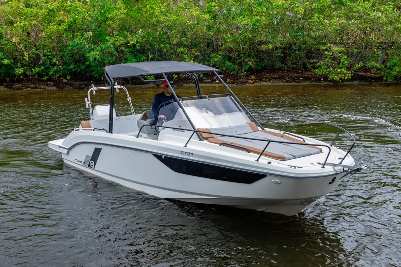 Slide: The Image of 2022 Beneteau America Flyer 8 Sundeck boat cruising on a calm river. - 2