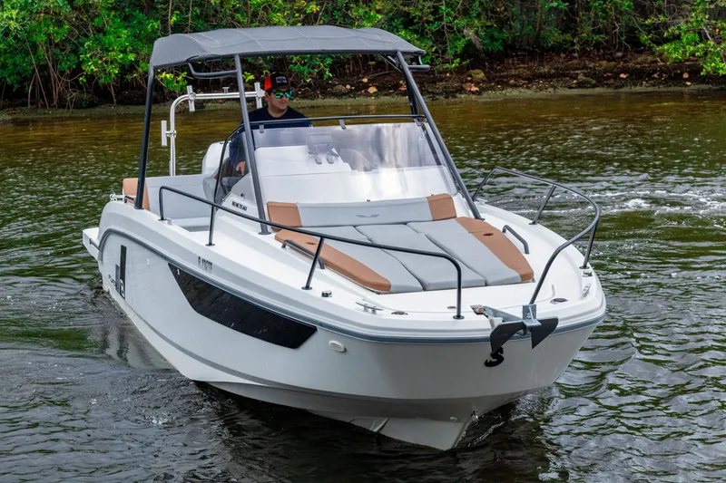 Slide: The Image of 2022 Beneteau America Flyer 8 Sundeck boat cruising on a calm river. - 22