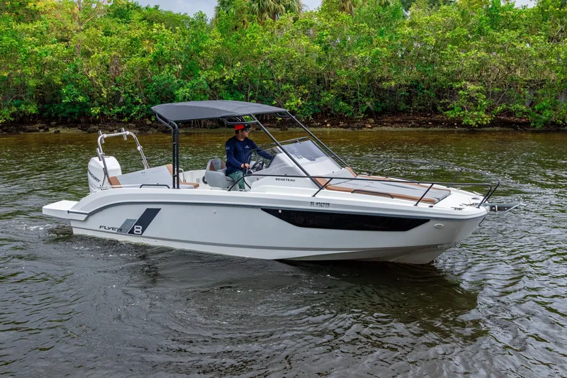 Slide: The Image of 2022 Beneteau America Flyer 8 Sundeck boat cruising on a calm river. - 23