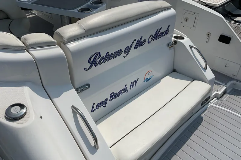 Slide: The Image of 2013 Rinker 290 Express Cruiser boat seat with "Return of the Mack" text, Long Beach, NY. - 4