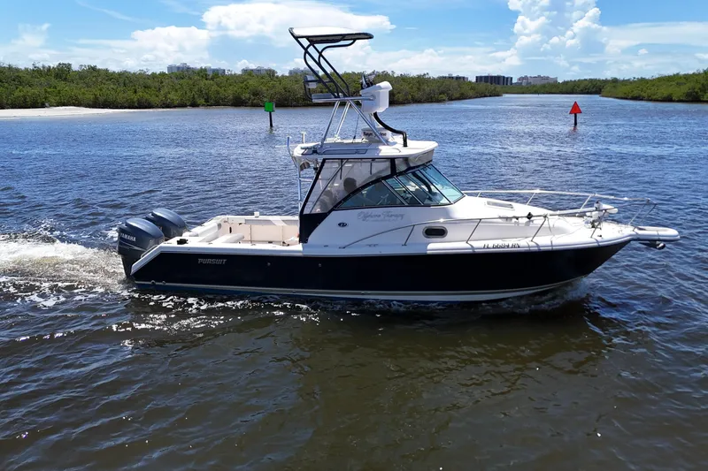 Slide: The Image of 2007 Pursuit OS 285 Offshore boat cruising on a sunny day in a scenic waterway. - 7