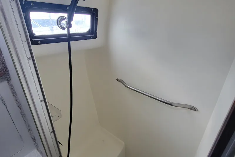 Slide: The Image of Shower area in a 1992 Mediterranean 38 boat with window and grab bar. - 7
