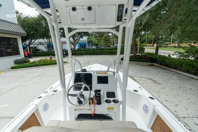 Slide: The Image of 2024 Sea Pro 208 Bay boat interior with steering console and seating. - 20