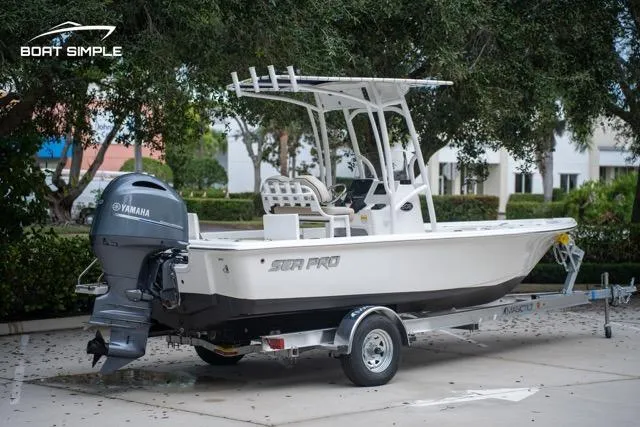 Slide: The Image of 2024 Sea Pro 208 Bay boat on trailer, featuring Yamaha outboard motor. - 3