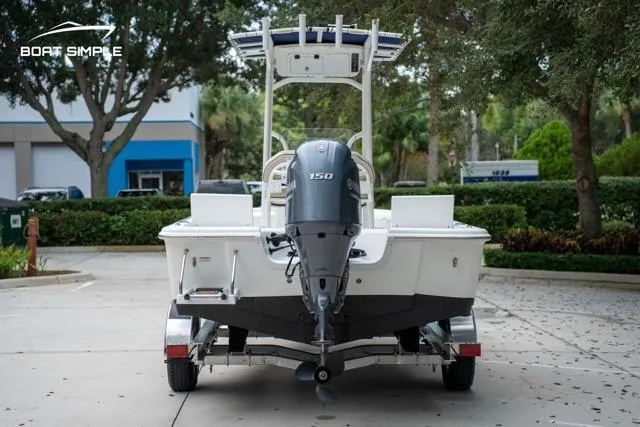 Slide: The Image of 2024 Sea Pro 208 Bay boat on trailer, rear view with outboard motor. - 6