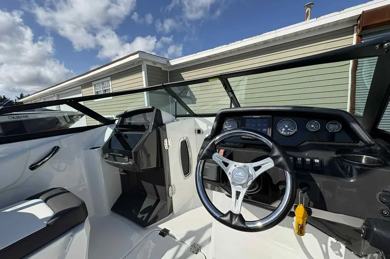 Slide: The Image of Engine compartment of a 2018 Monterey M65 boat, showing wiring and hydraulic components. - 11