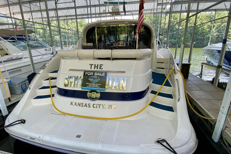 Slide: The Image of 1999 Neptunus 54 Hardtop Express yacht for sale, docked in Kansas City marina. - 14