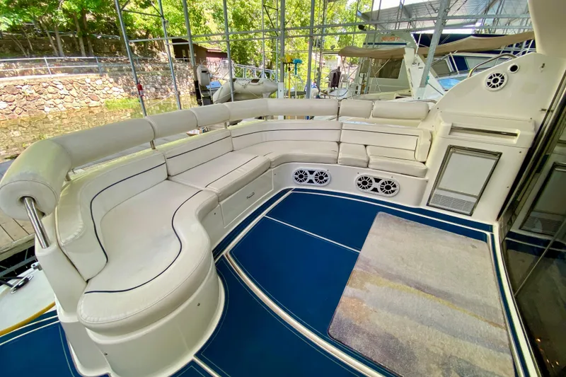 Slide: The Image of Luxurious seating area on a 1999 Neptunus 54 Hardtop Express yacht. - 15