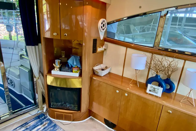 Slide: The Image of Luxurious interior of 1999 Neptunus 54 Hardtop Express yacht with elegant wood cabinetry. - 27