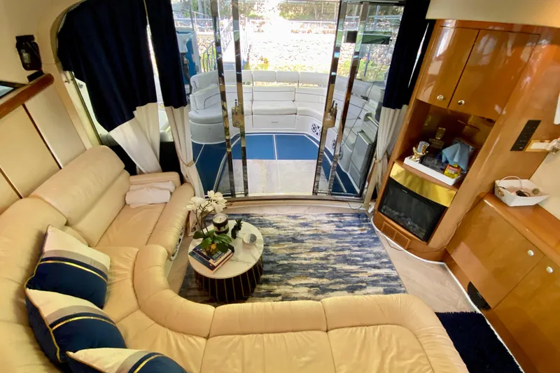 Slide: The Image of Luxurious interior of 1999 Neptunus 54 Hardtop Express yacht with plush seating and elegant decor. - 28