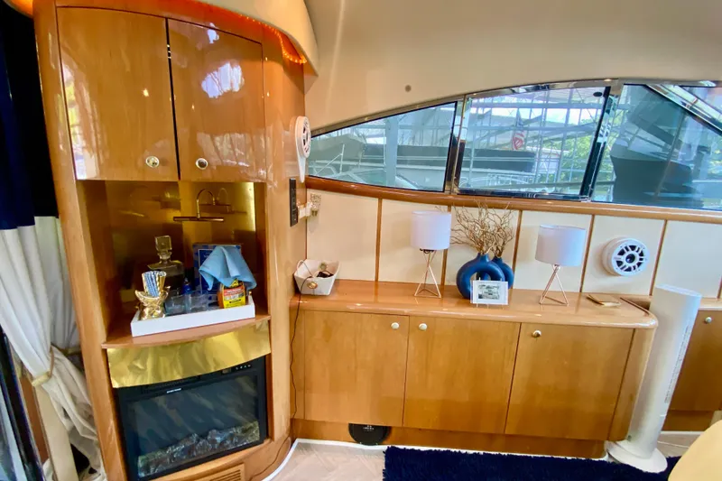 Slide: The Image of Interior of 1999 Neptunus 54 Hardtop Express yacht with elegant wood cabinetry and decor. - 29