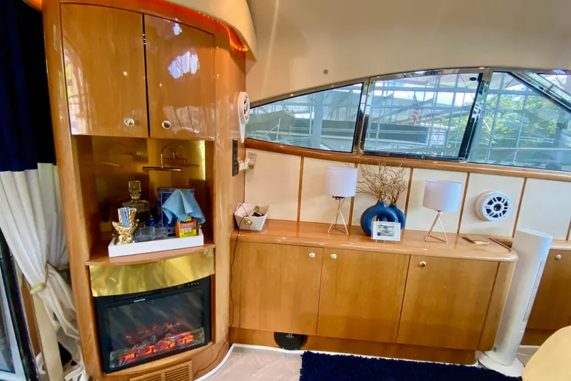 Slide: The Image of Luxurious interior of 1999 Neptunus 54 Hardtop Express yacht with elegant wood cabinetry and decor. - 30